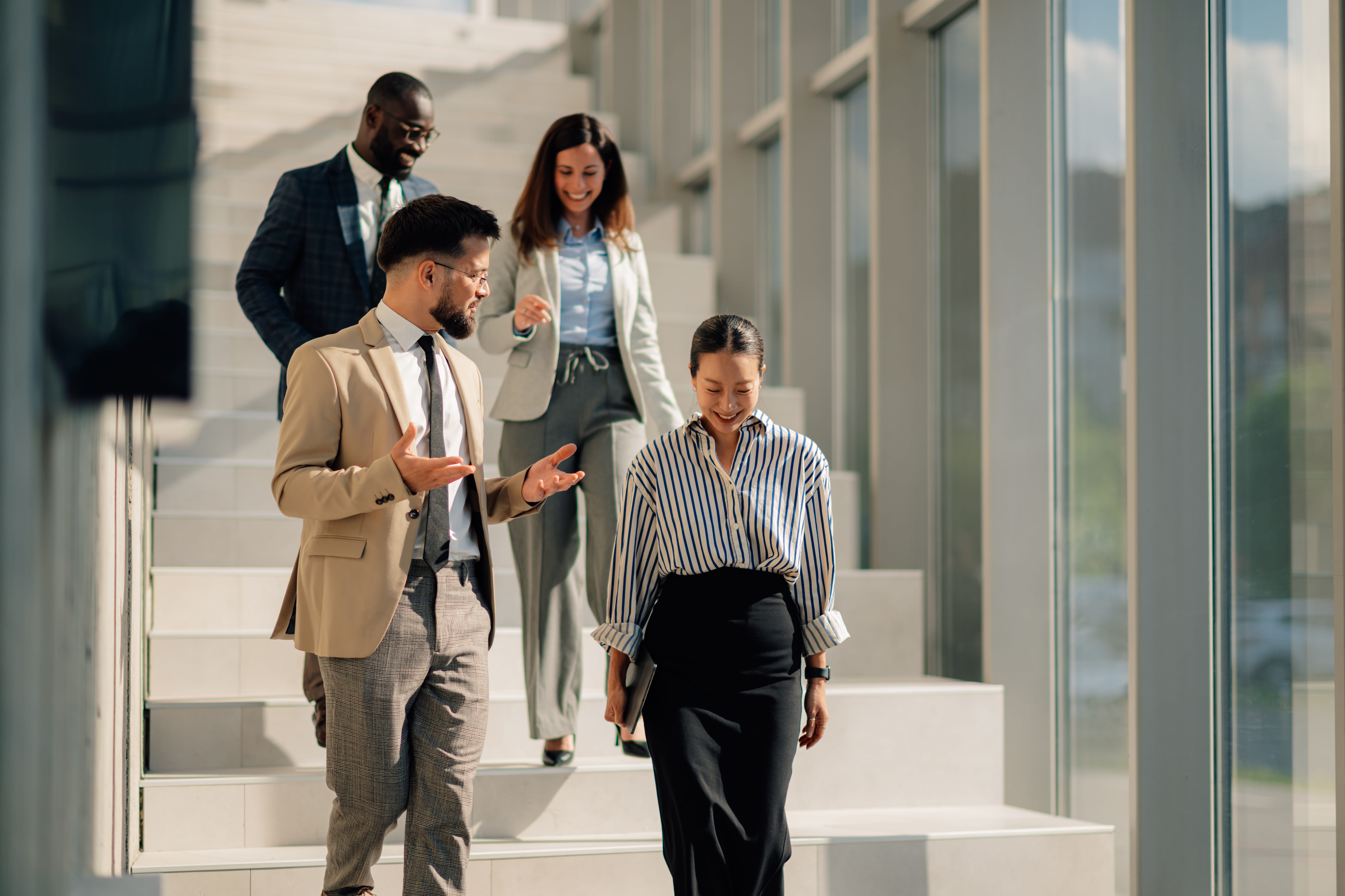 Business people walking down the stairs